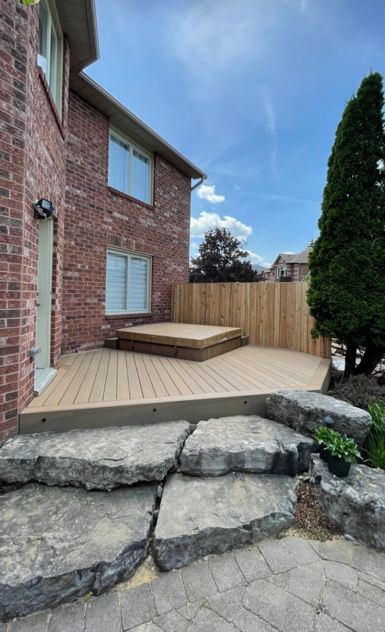 Two-level deck over a stone patio built by Escarpment Contracting Co. in Georgetown