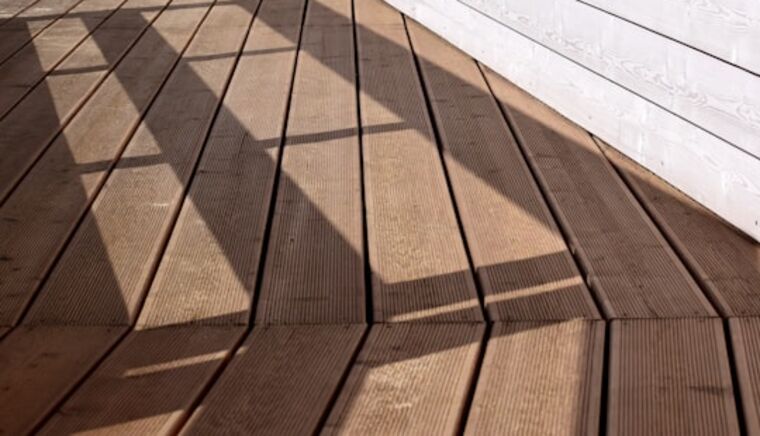 Grooved brown pressure-treated deck boards, material example