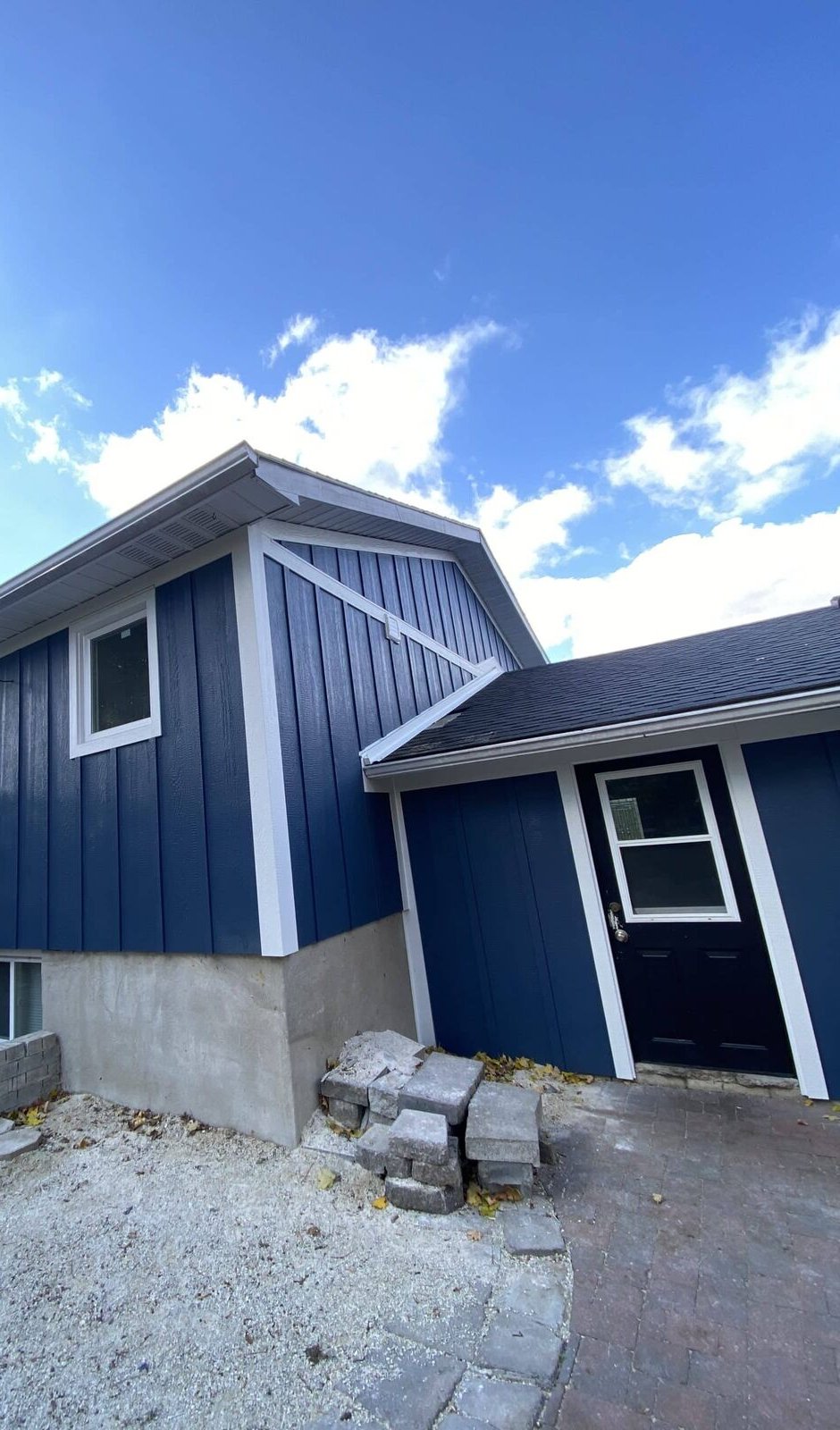 LP board and batten siding in navy on a home in Erin