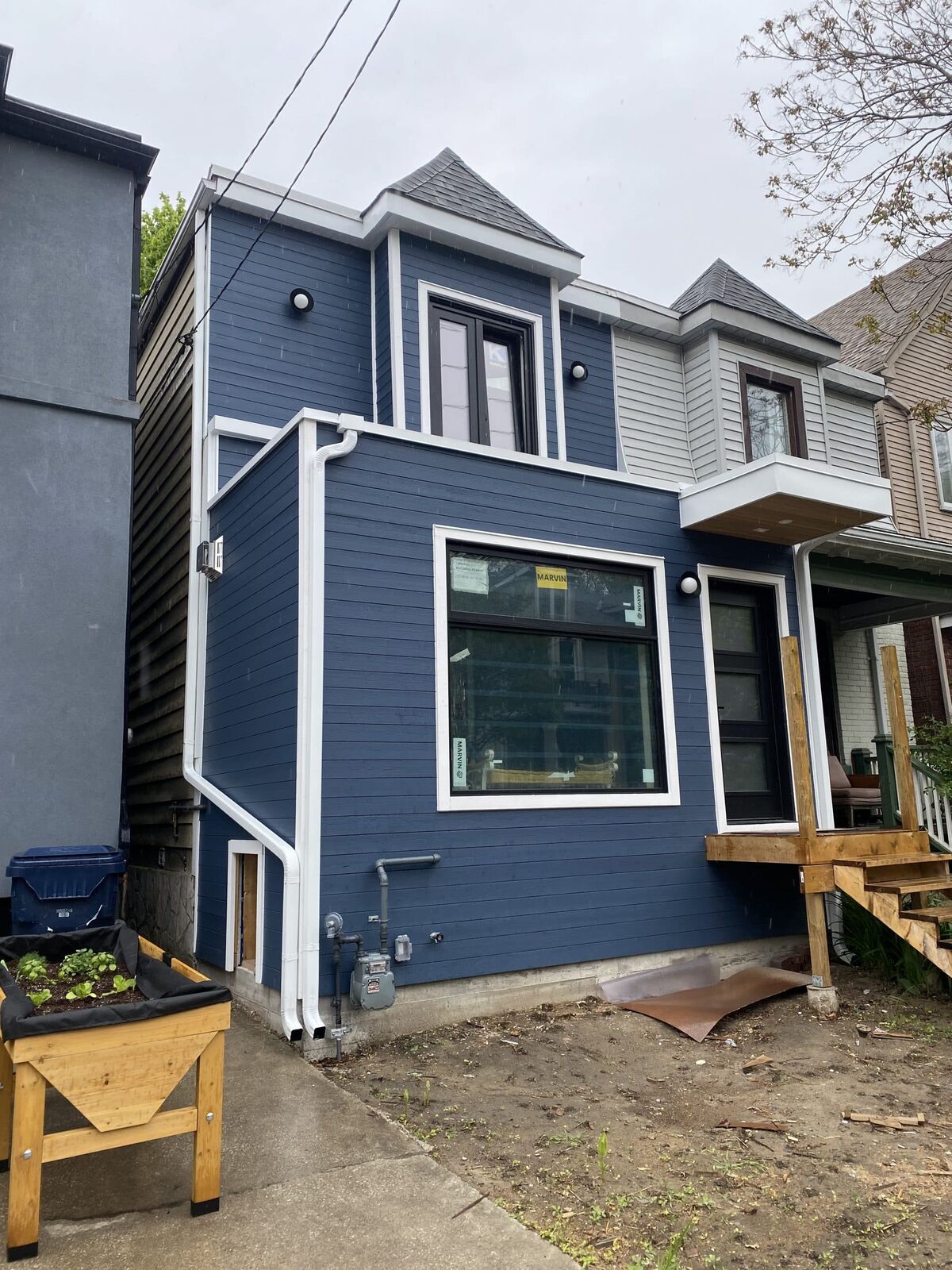 Navy siding with cedar accents in Winnifred